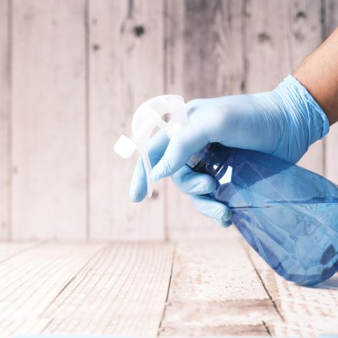 Spray bottle on wood floor