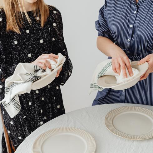 Two people drying dishes