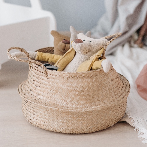 A wicker basket of children's toys