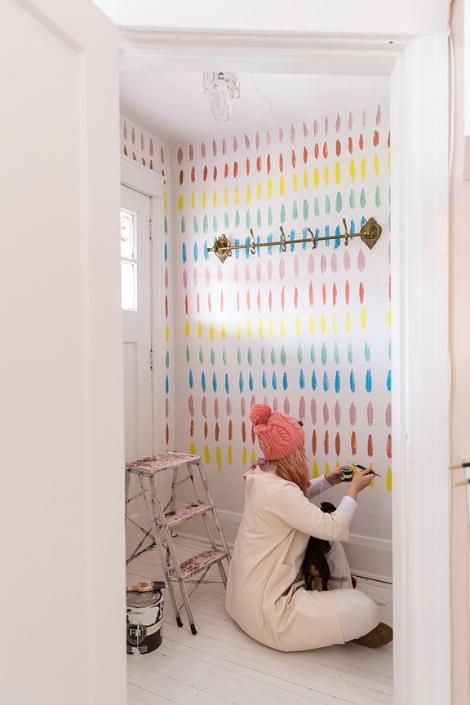 Tiffany Pratt painting a statement wall
