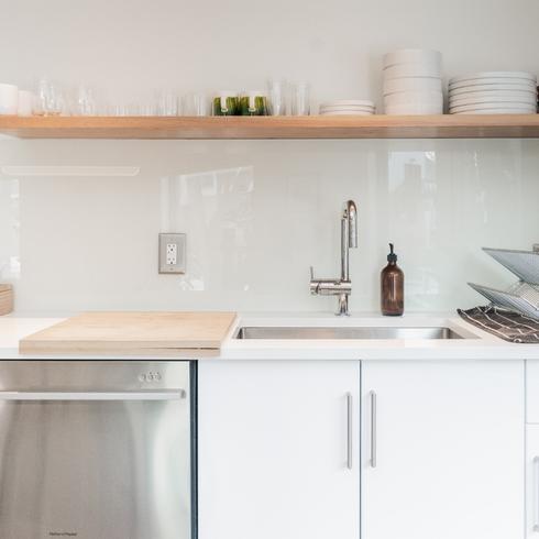 a clean kitchen with white cabinets