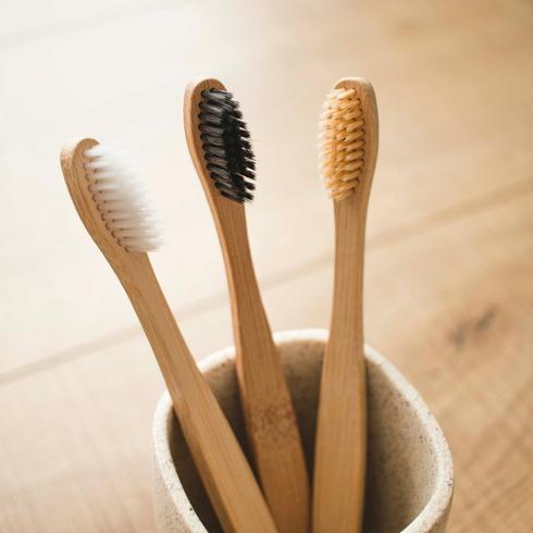 three bamboo toothbrushes