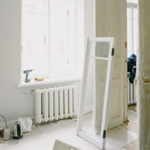 Renovation in apartment covered with clear plastic tarp