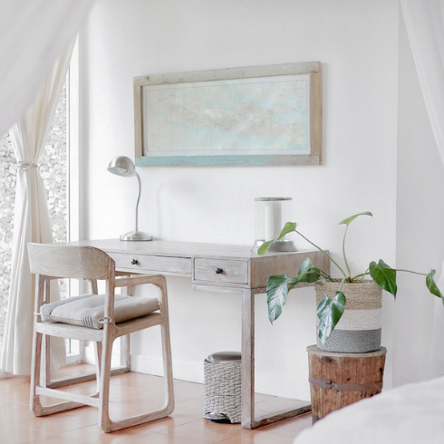 light-wood desk and chain in white bedroom