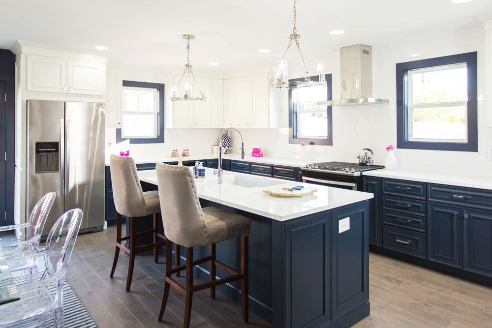 Blue and white modern kitchen design with large island.