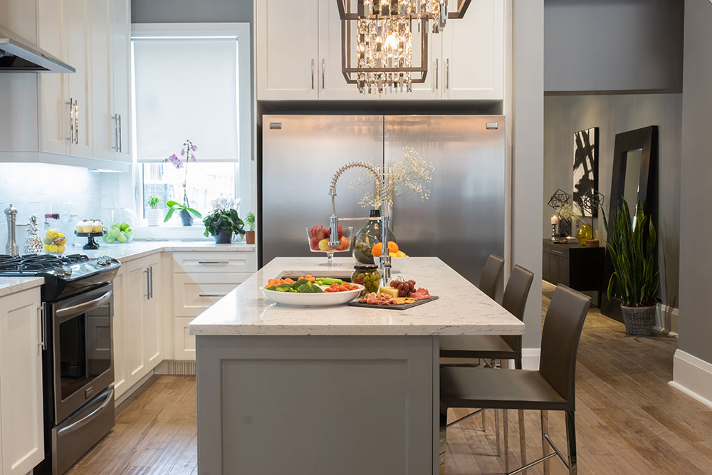 Big, blingy chandeliers are a surefire way to bring glamour to a small kitchen.