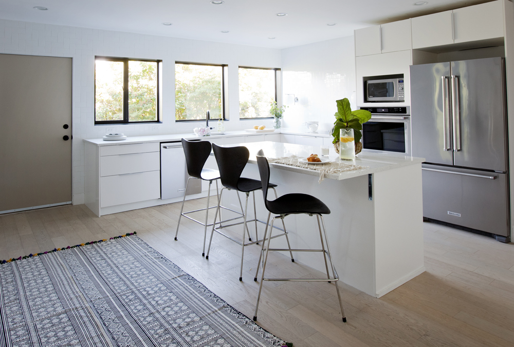 Underground Beauty Modern white kitchen in a basement apartment