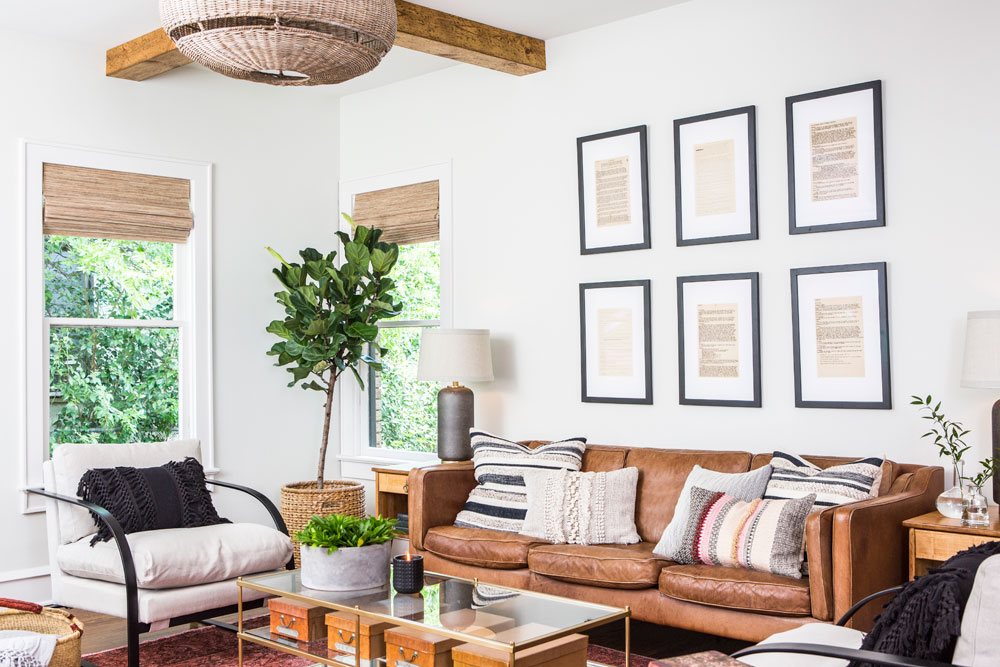 Southwestern farmhouse living room with caramel tones, earthy off-whites, rattan and boho textiles