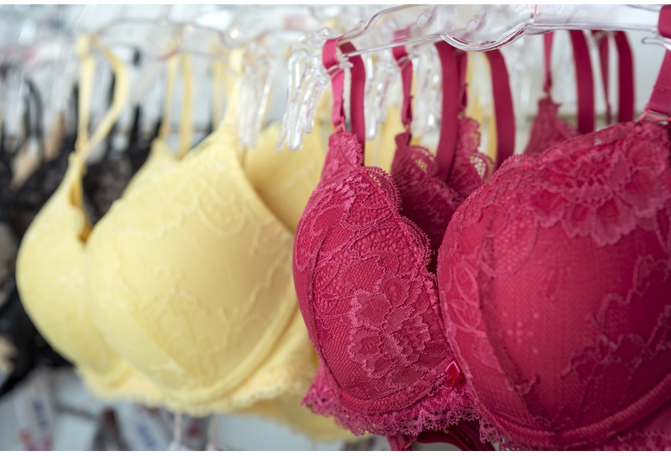 underwire bras hanging in a store