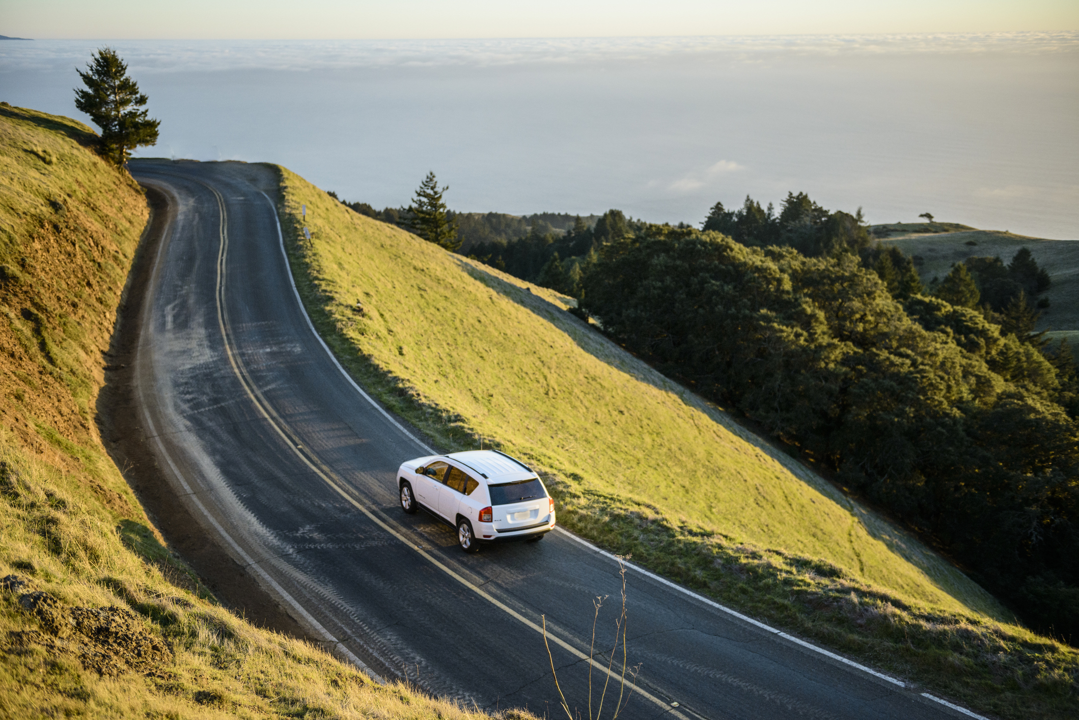 Car Driving Up Windy Mountain Coastal Road