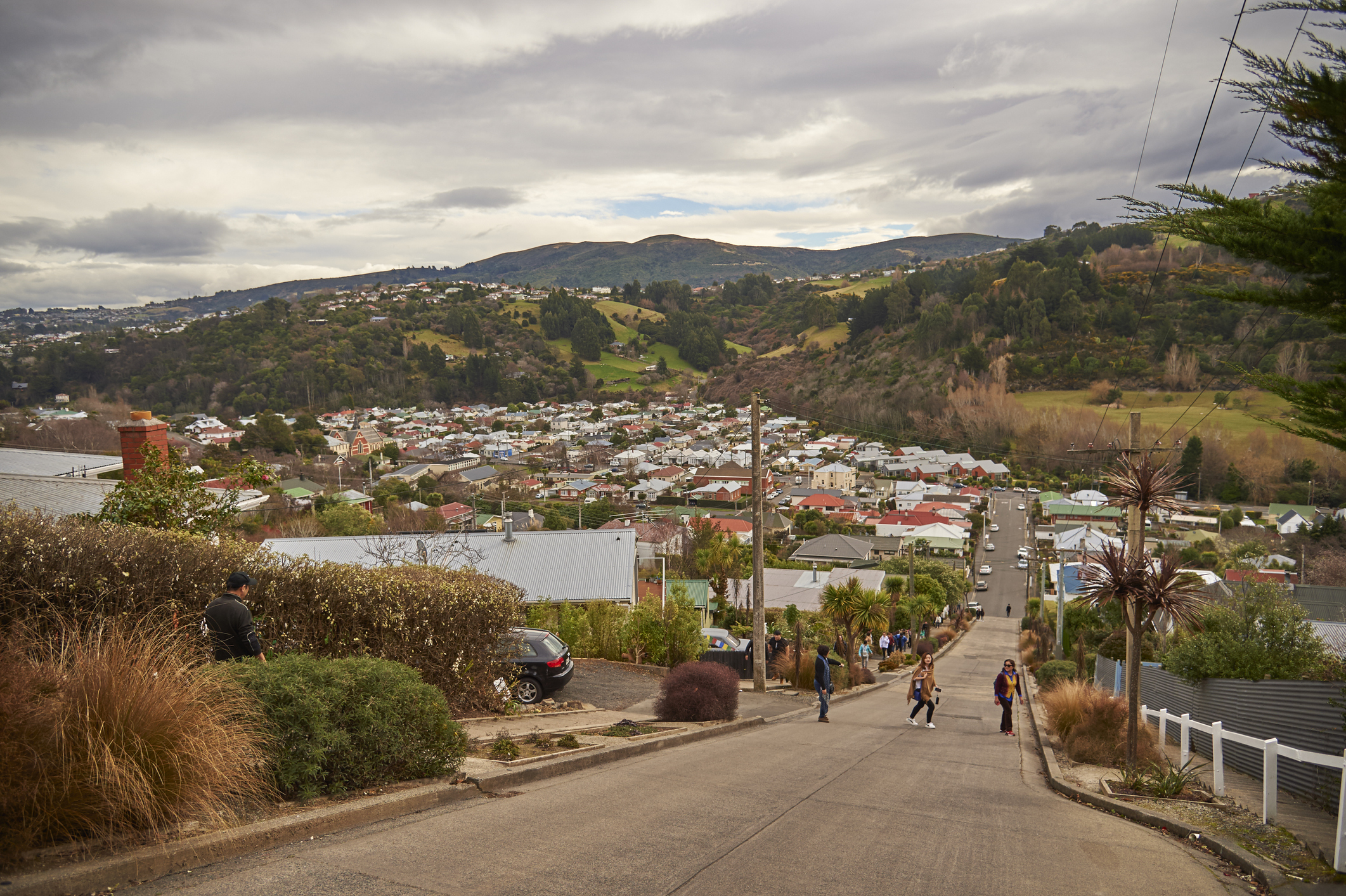 Friends walking up a steep hill