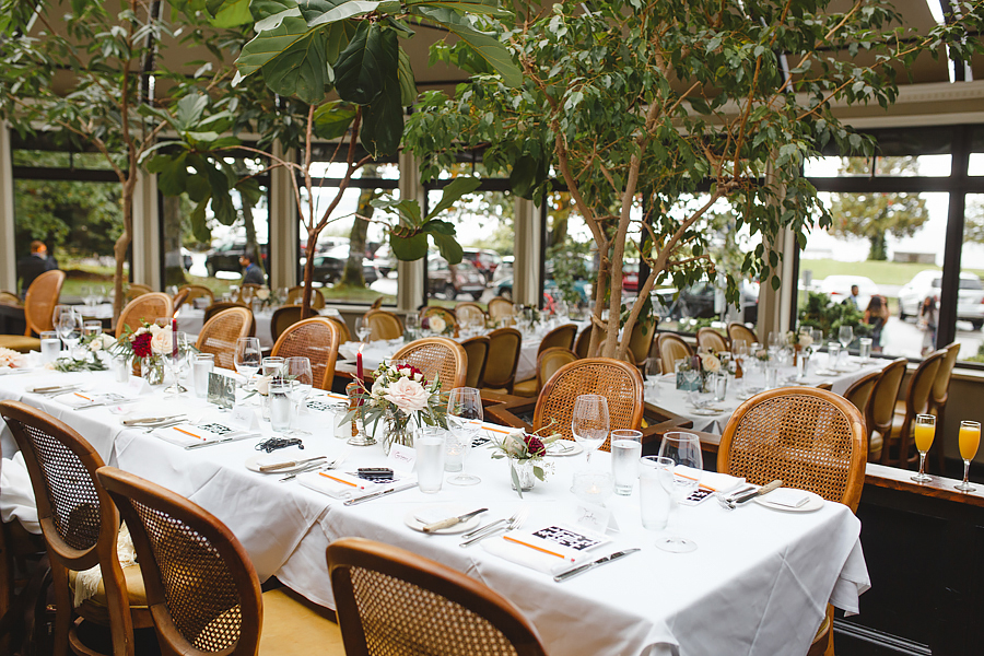 Interior of Teahouse in Stanley Park, with beautifully set tables for wedding