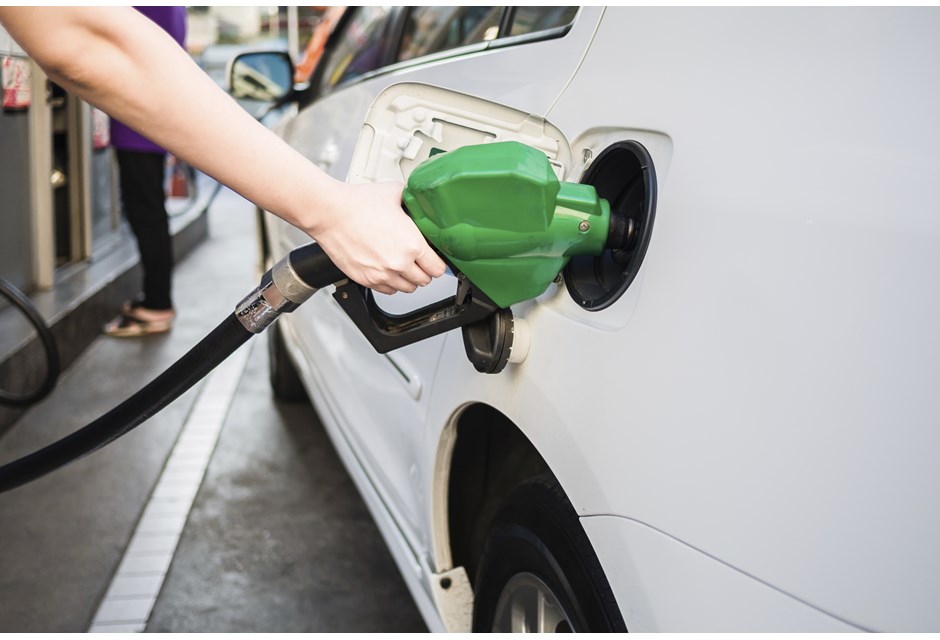 pumping gas at gas station