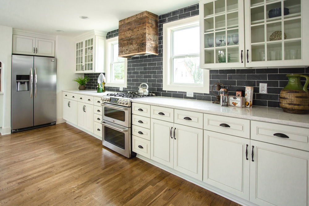 Modern farmhouse kitchen with black subway tile backsplash.