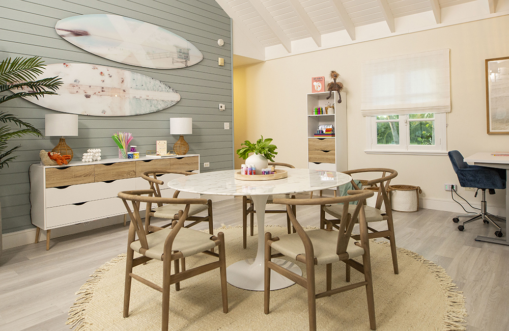 The new school house on Island of Bryan with a circular table and four wooden chairs.