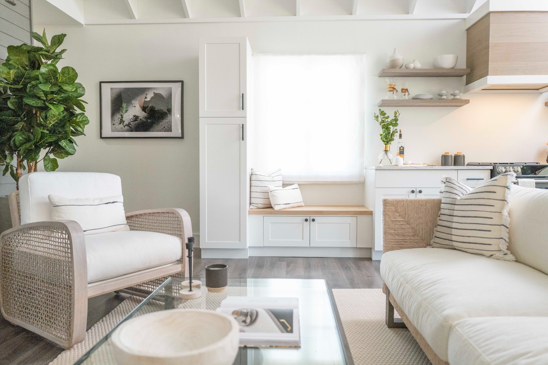 Beachy white villa with seating space and coffee table