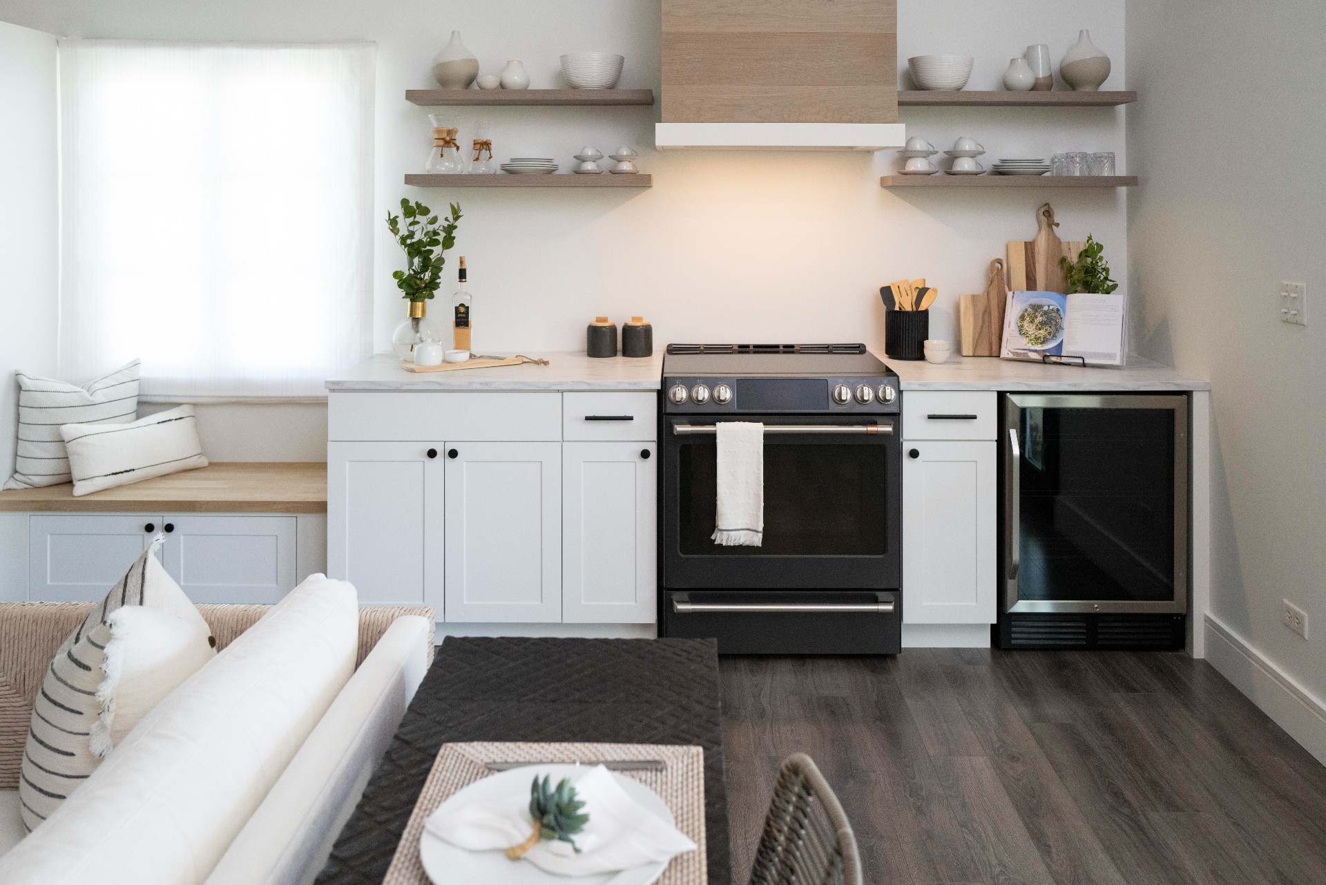 Family villa kitchen with white cabinets