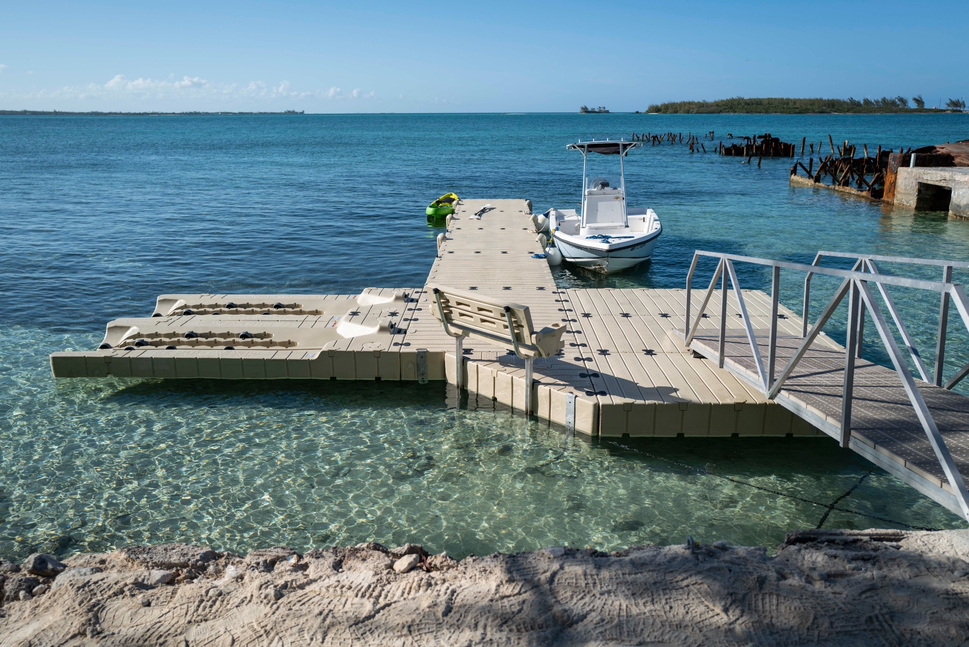 White boat stationed at floating dock