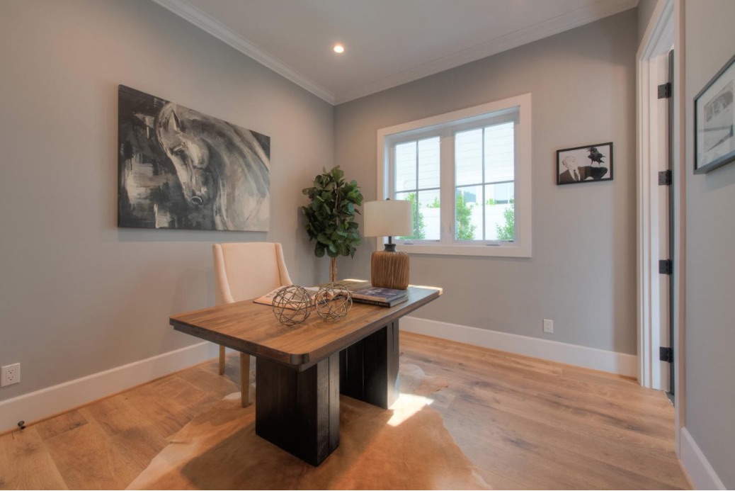 A sparse home office with a wooden desk