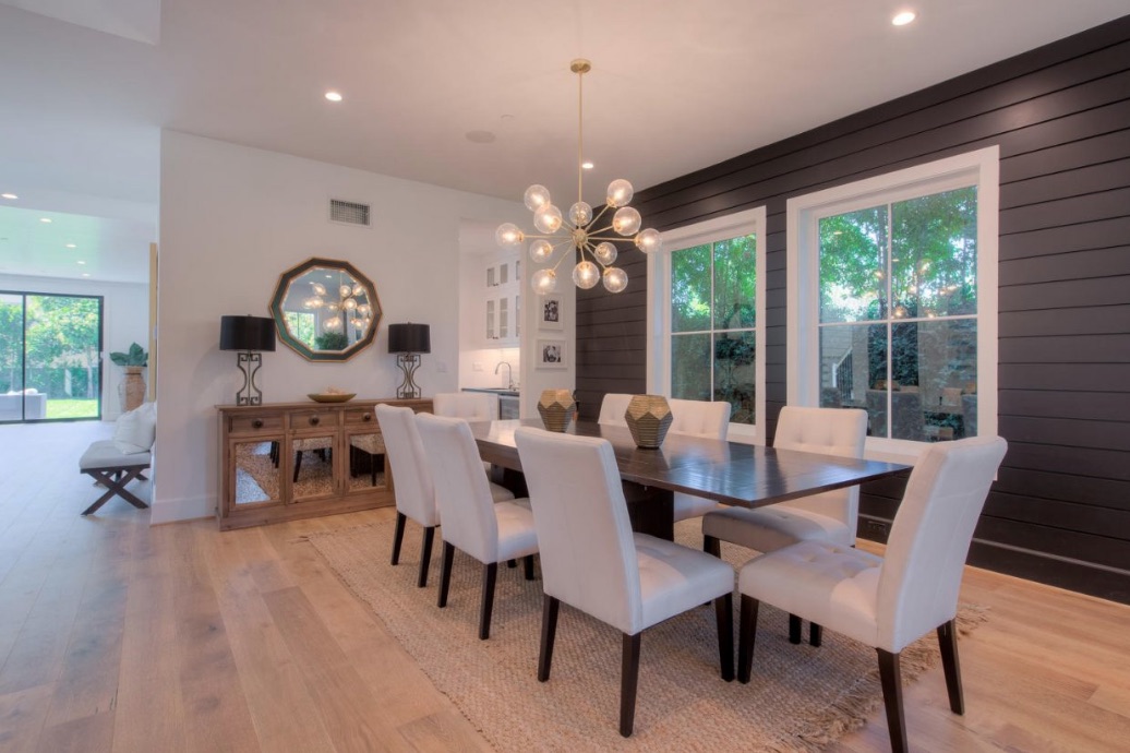 The open-concept dining room features plenty of natural light