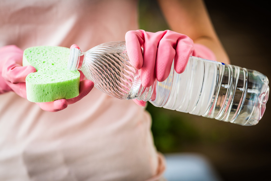 Pouring vinegar on a sponge