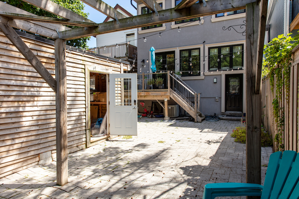 before of empty backyard with wooden garage