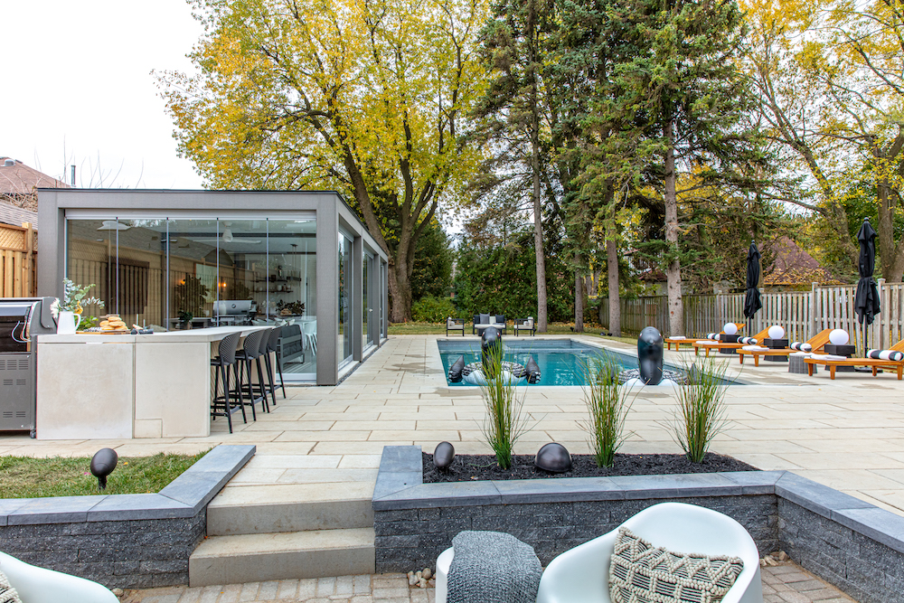 resort-style backyard with glass lanai and outdoor pool