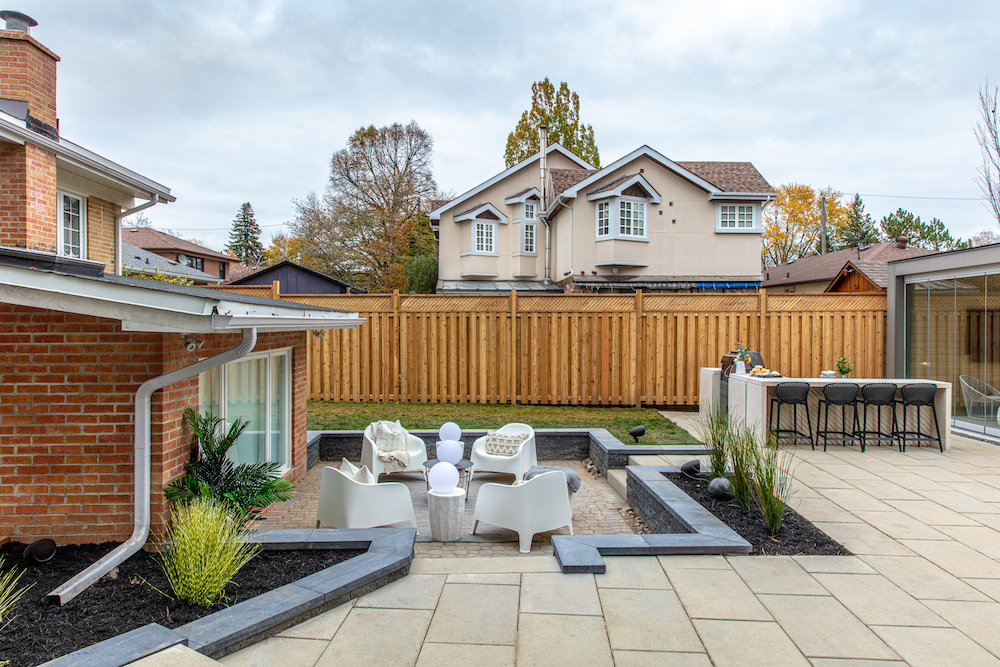 sunken outdoor lounge area with four chairs