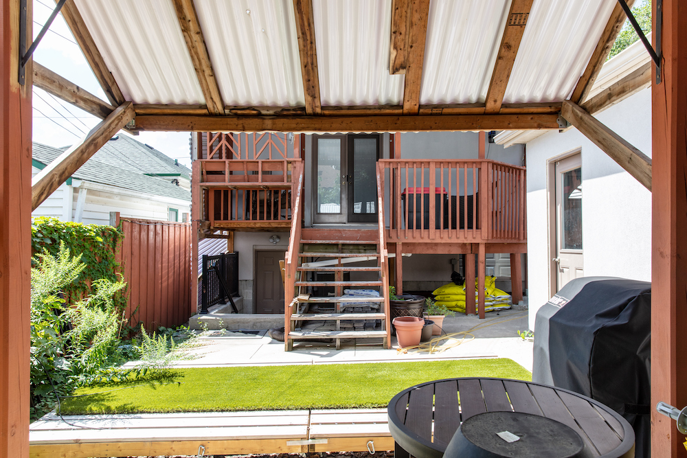 before of backyard, with old wooden deck and pergola