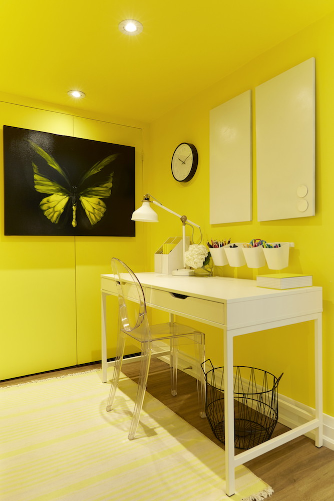 Basement nook with yellow paint and desk