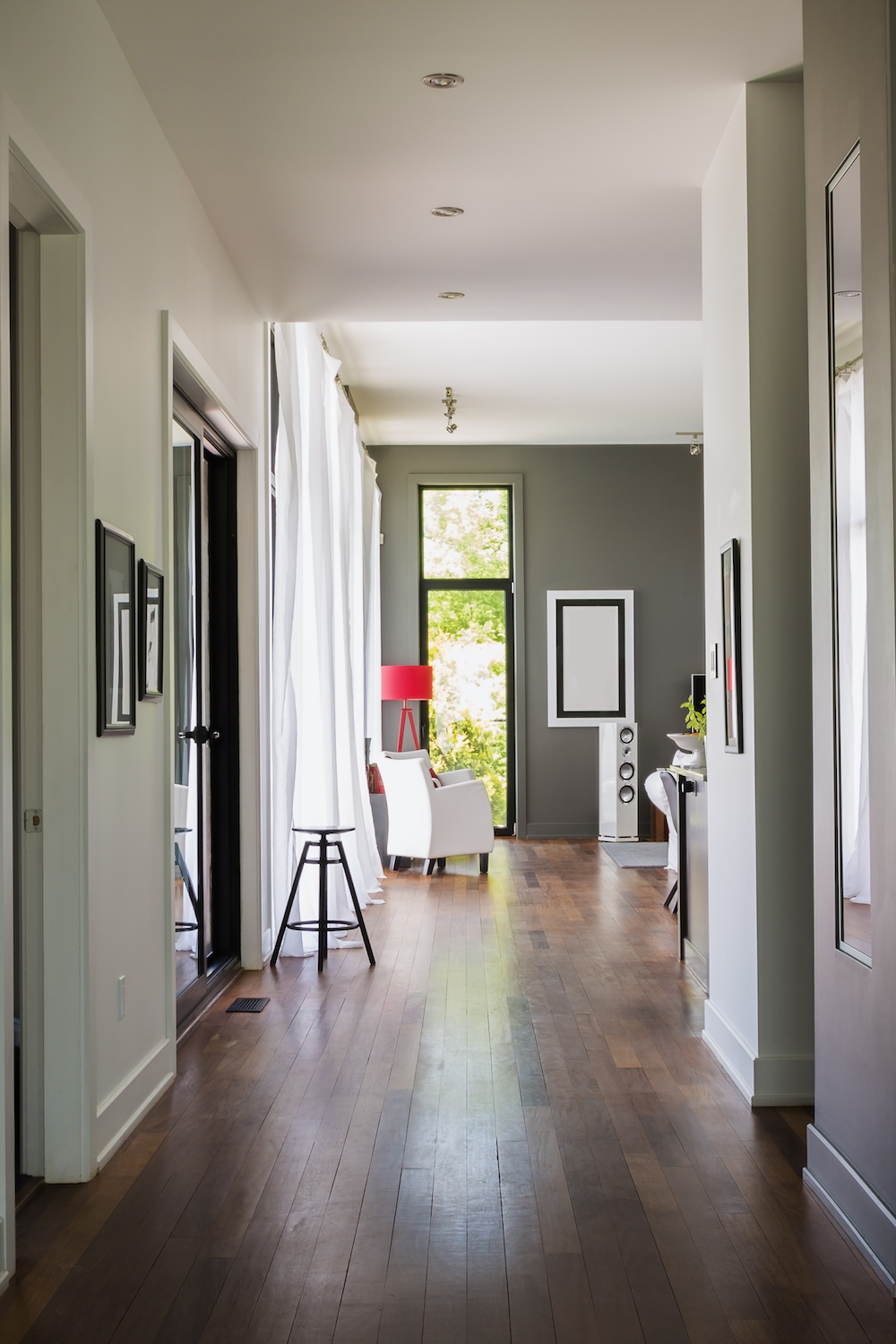 bright hallway with dark wood floors