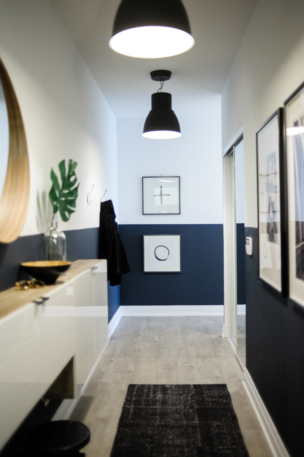 modern black and white hallway with dark carpet