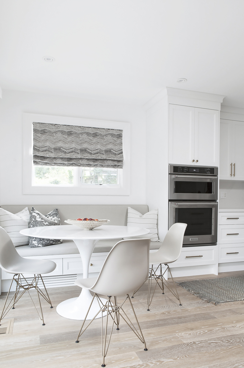 A breakfast nook flooded with natural light from a window