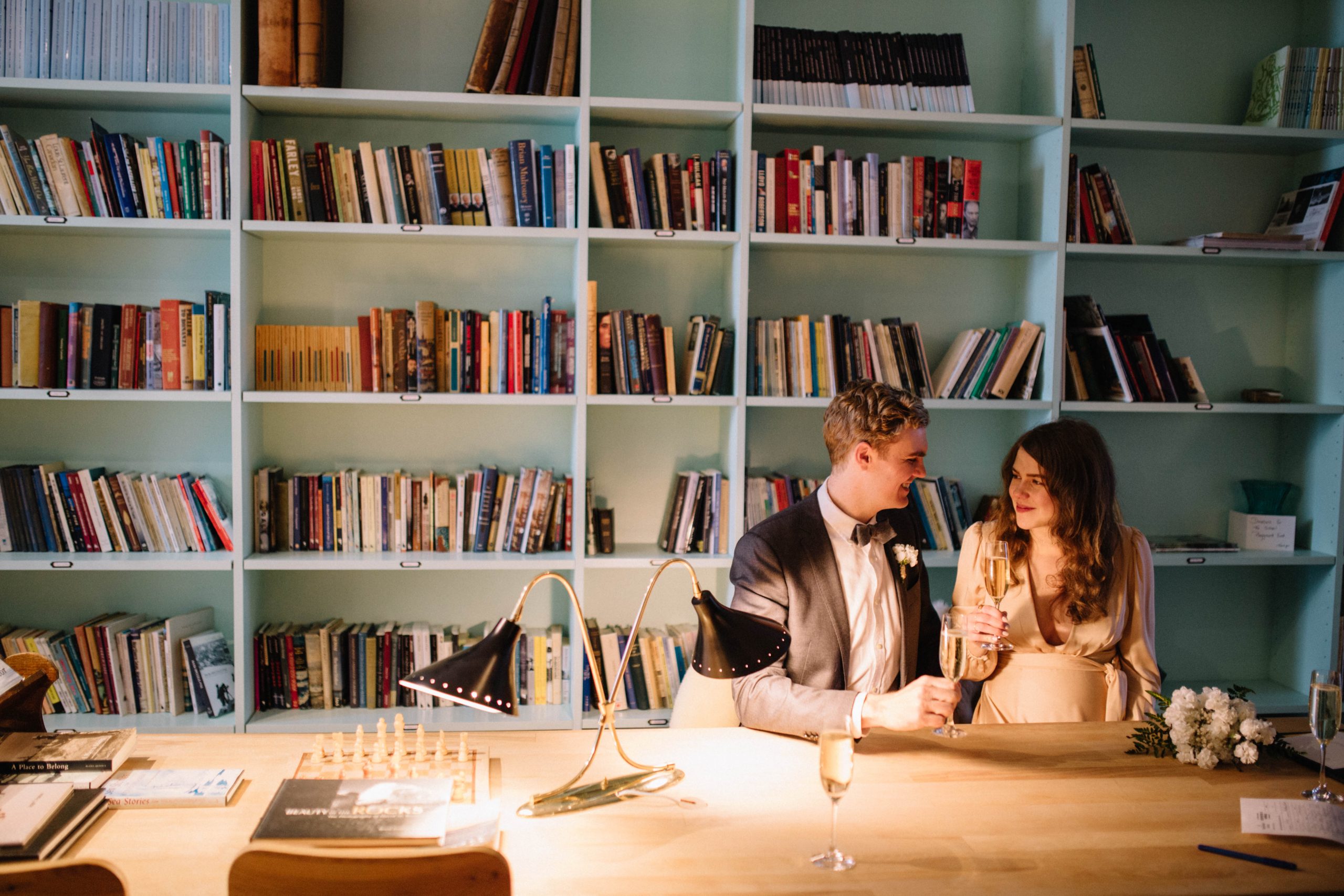 Couple toasting inside Fogo Island Inn study