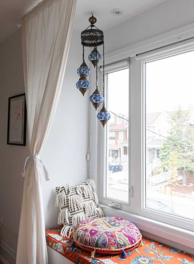 Patterned window seat with two pillows