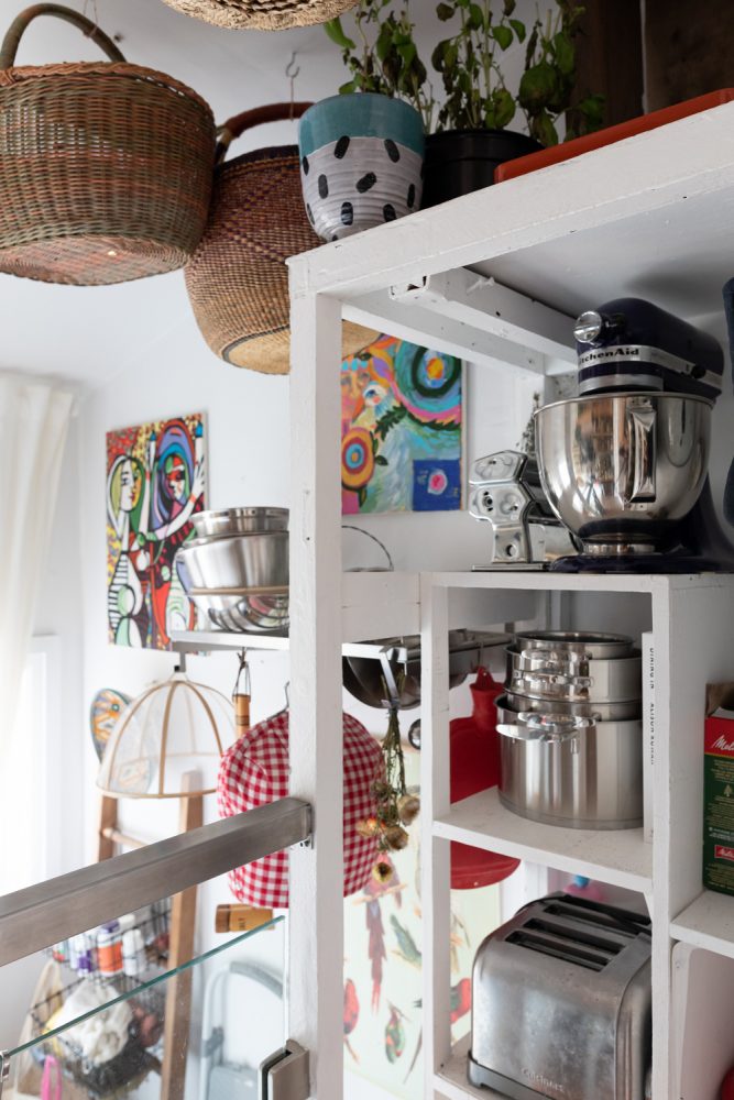 White shelves with hanging baskets