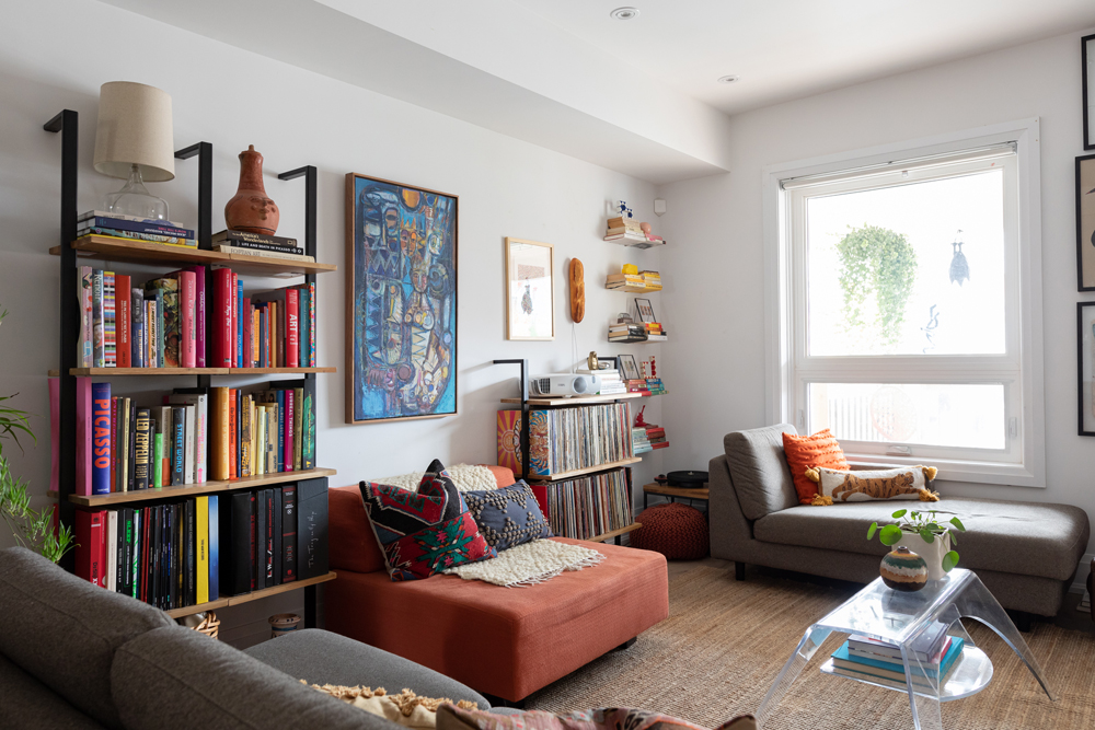 White living room with ladder shelving and chaise