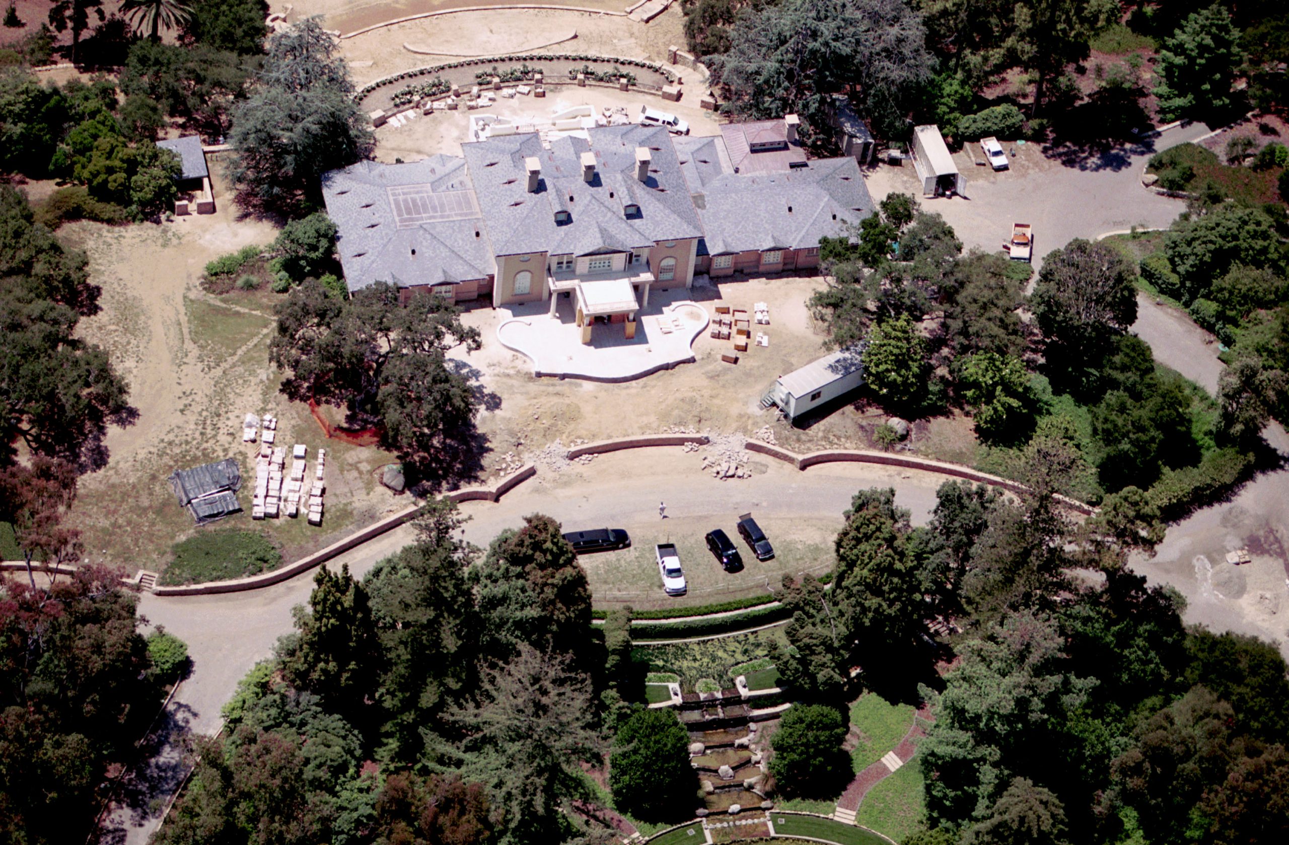 An exterior shot of a 42-acre lot featuring six bedrooms, 14 bathrooms, 10 fireplaces, and more