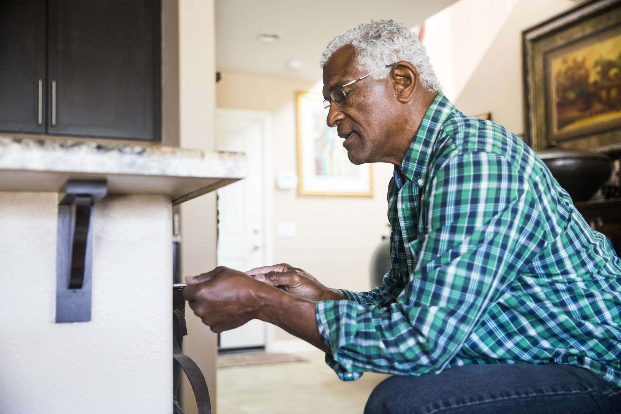 Man makes home repairs on electrical socket