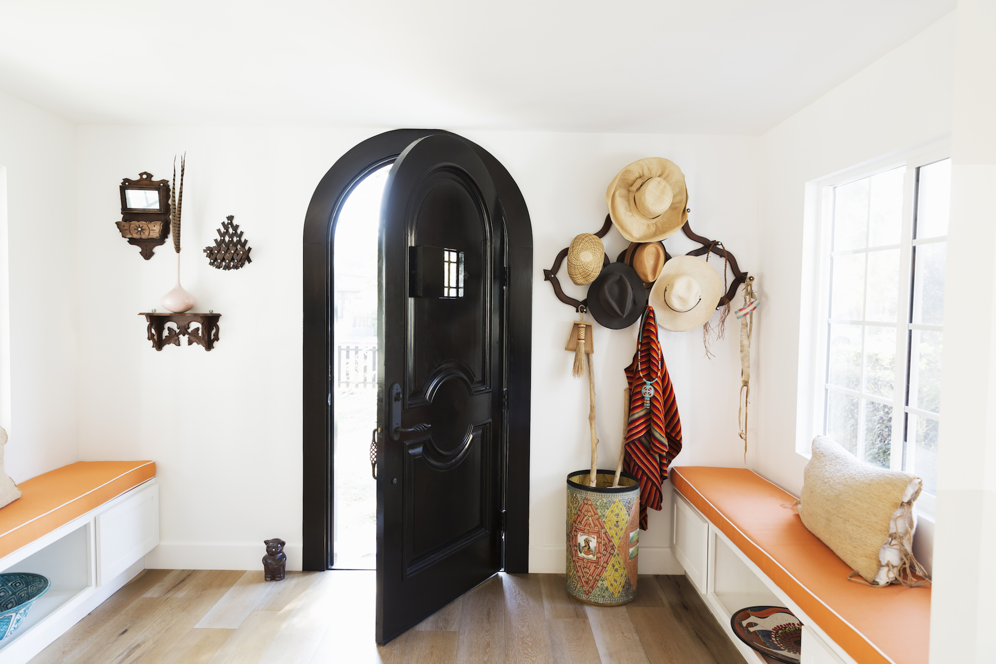 modern front entryway with two built-in benches that include storage