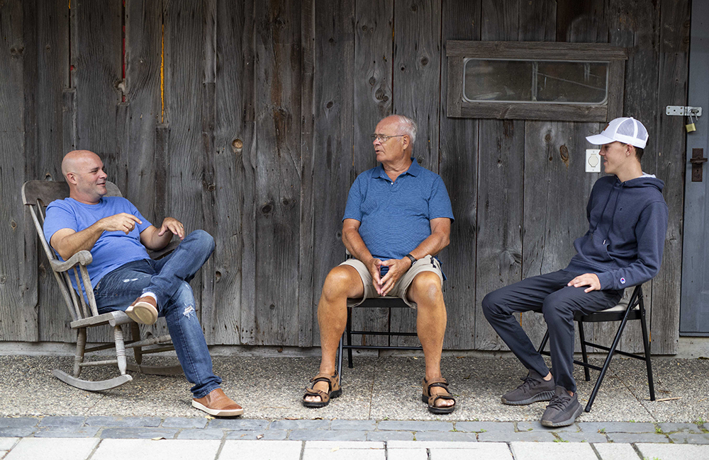 Bryan Baeumler with his dad and son.