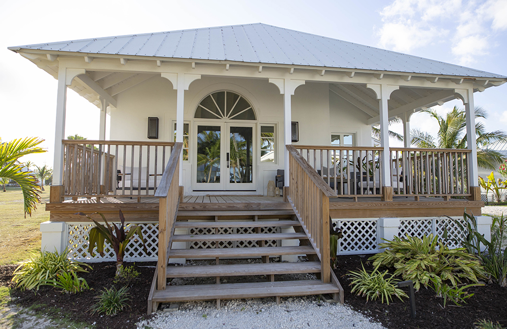 A villa at the Island of Bryan resort on a sunny day.