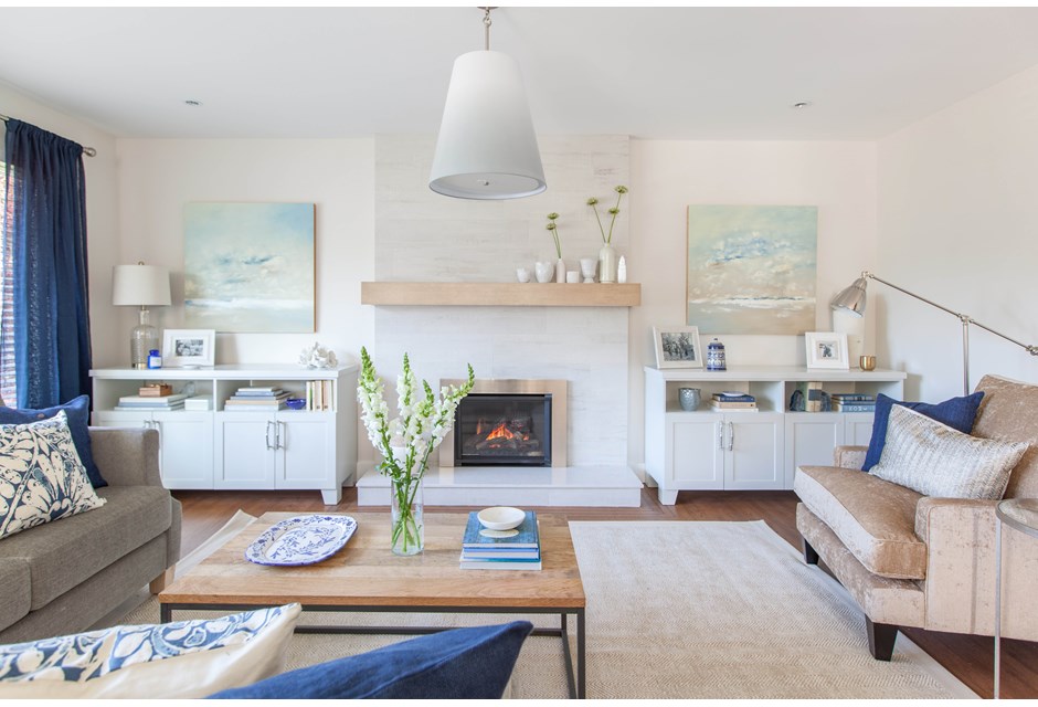 Modern living room with cabinets flanking fireplace