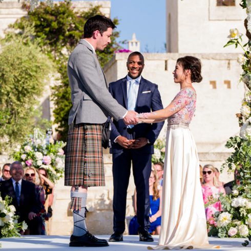 Drew Scott and Linda Phan Wed in Picturesque Coastal Town Drew Scott and Linda Phan exchanging vows during their wedding ceremony