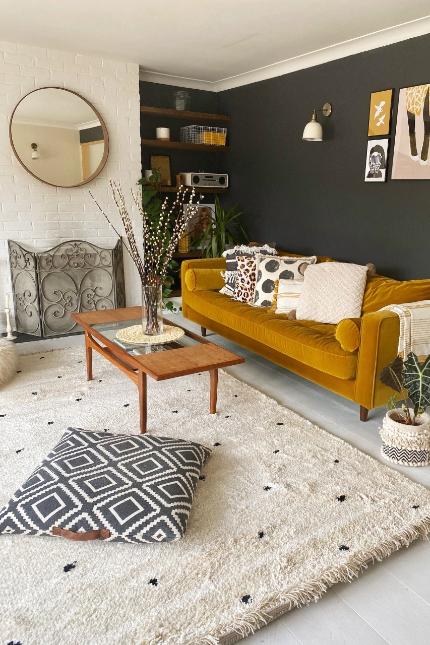 A basement apartment living space with area rug and throw pillows