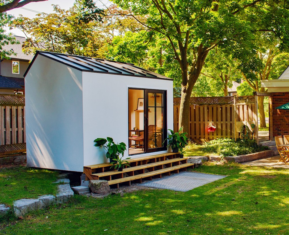 White office pod in backyard