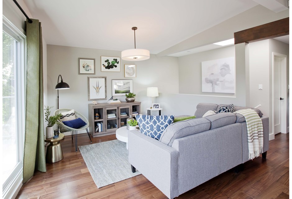 couch in grey open-concept living room