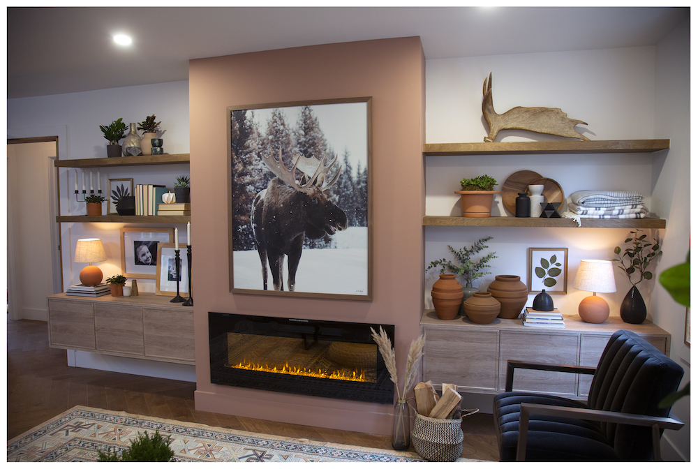 cozy white living room with peach bump out and fireplace