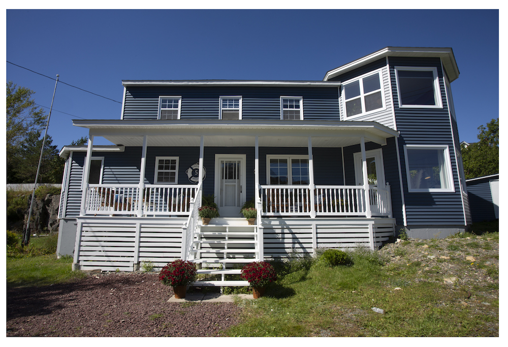 exterior of the Gushue house with blue paint and white trim