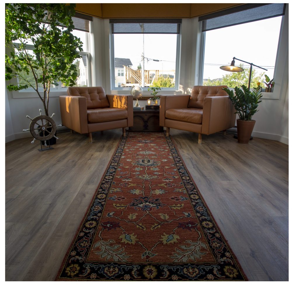 two brown chairs in front of windows in nautical-themed study